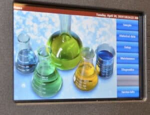 a picture of laboratory beakers filled with colorful liquids