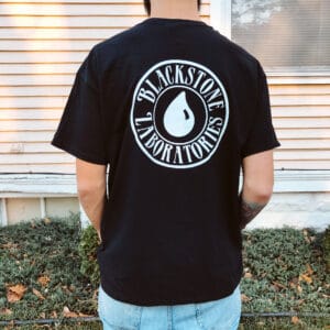 Blackstone Joe modeling a black Slick Talk shirt