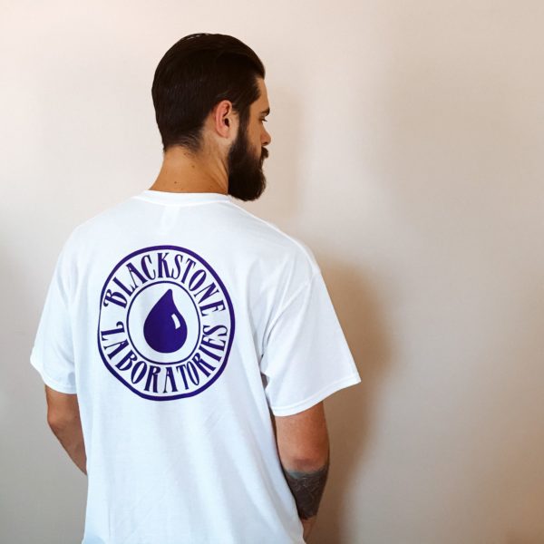 Blackstone logo in purple on back of white T shirt