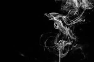 An photo of white smoke on a black backdrop, similar to the vapors we use in the flashpoint test for finding fuel contamination in oil samples.