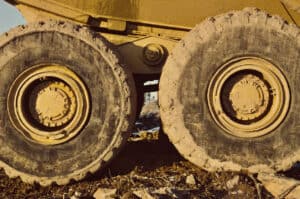 The rear tires of an off-highway dump truck.
