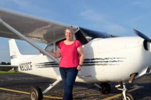 Amanda standing in front of an airplane