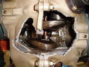 Giant hole through the case sidewall from connecting rods blowing out