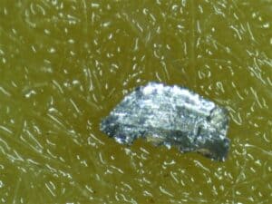 Metal from the filter, magnified in analysis