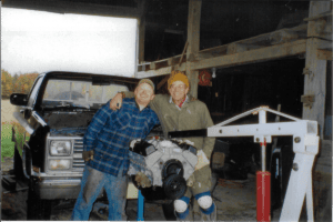 Happy Jim and Ryan posing behind the engine from the '84 Chevy.