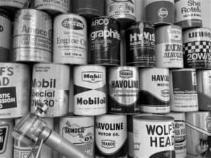 Black and white image of all the old oil cans we bought off eBay