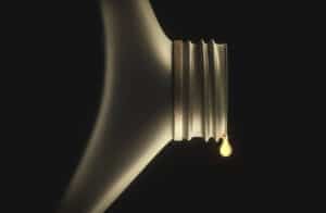 drop of oil falling out of a bottle