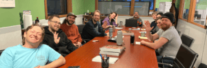 A small staff gathering in the conference room