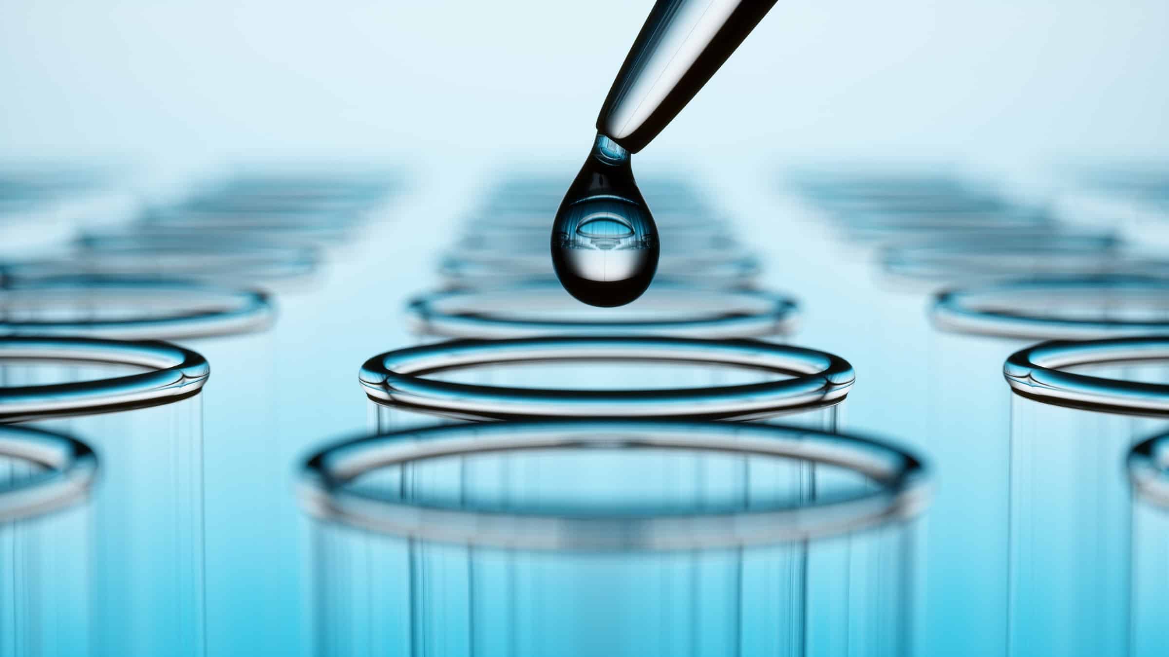 Blue Glassware With Oil Drop (2400 X 1349) Close-up of a drop of liquid going into a test tube