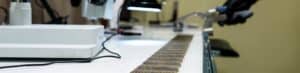 A close-up photo of filter pleats spread across a lab bench for inspection.
