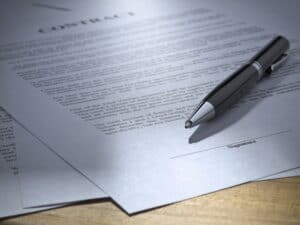 Close up of a pen on a legal-looking contract