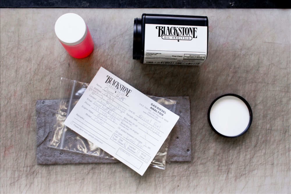 Image of an oil sample kit with all the components laid out