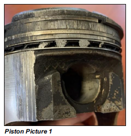 Image of a burned piston out of Ryan's Jimmy