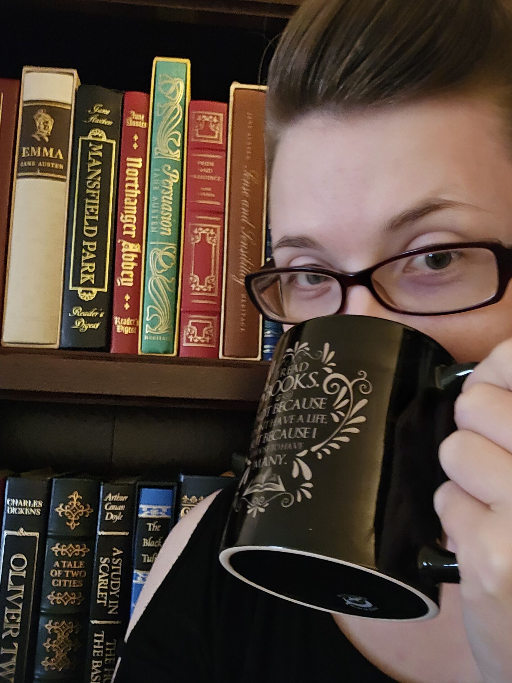 Deborah holding a coffee cup
