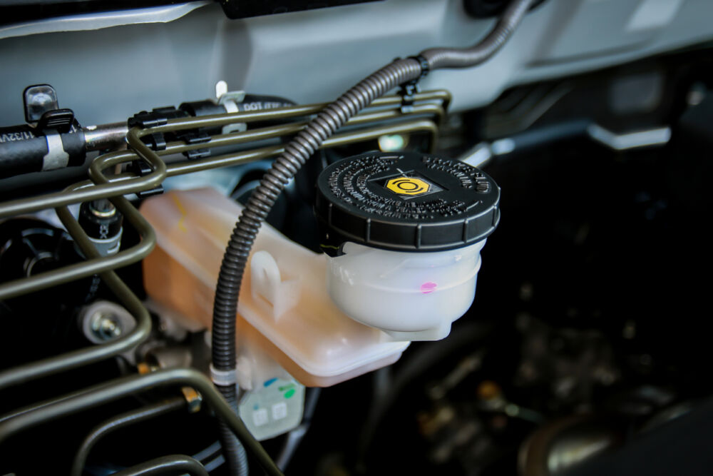 Brake fluid reservoir in a car engine