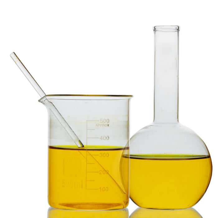 Oil in glass flasks with a glass stir stick