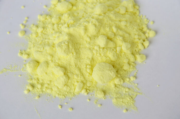 sulfur powder on white paper