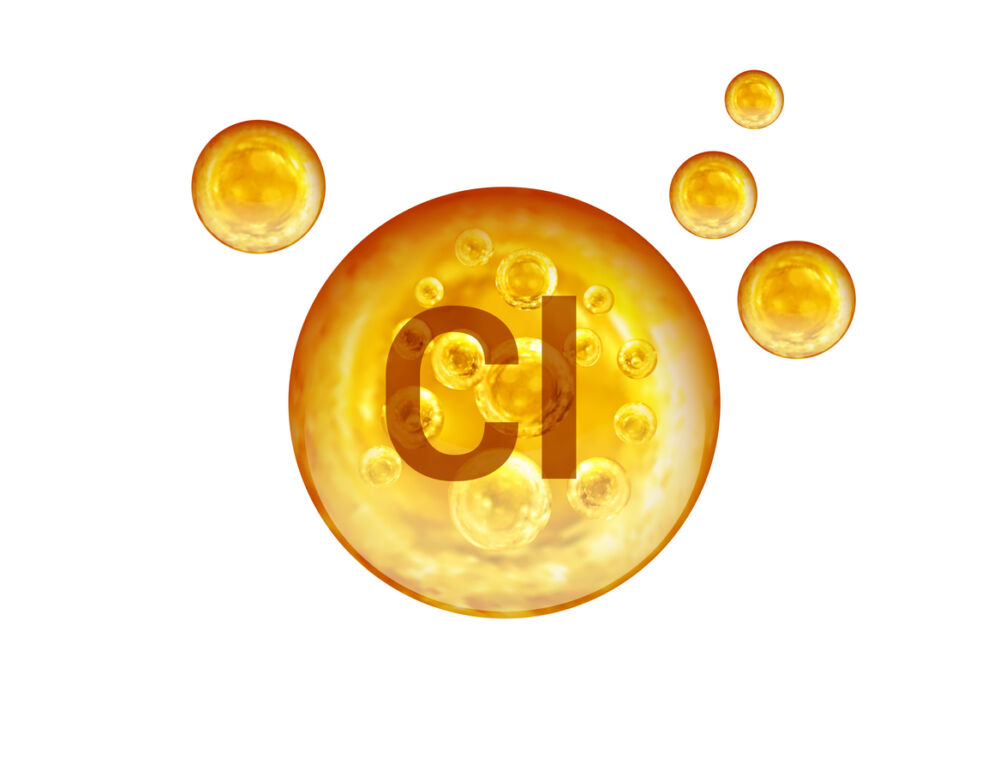 Chemical symbol for chlorine in golden balls isolated on white background
