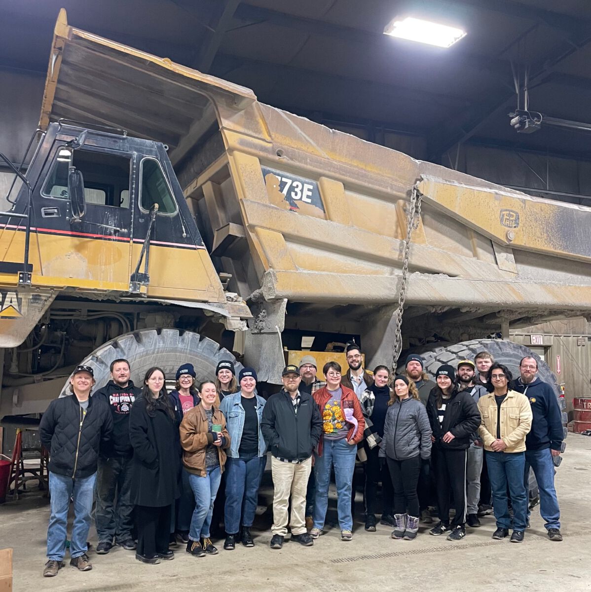 oil pouring from bottle into engine