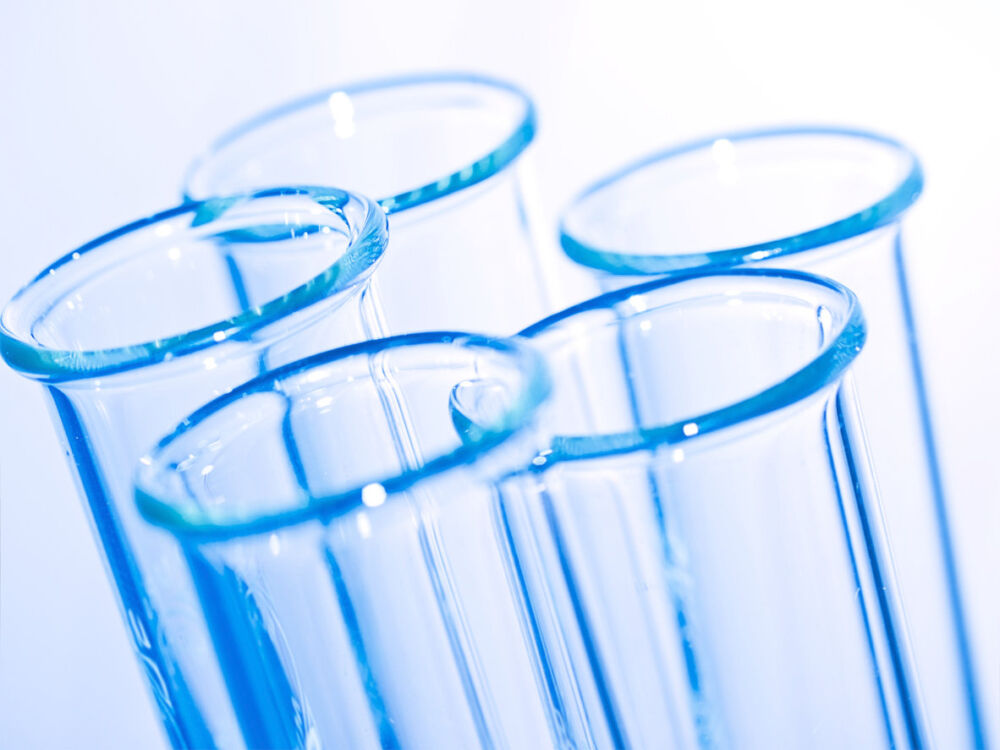 set of 5 test tubes in a blue light